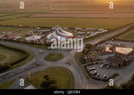 Planet Circus performing in Scarborough North Yorkshire , Aerial Drone From the air Birds eye view Stock Photo