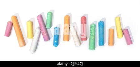 Variety of colored chalk sticks isolated on white background Stock Photo