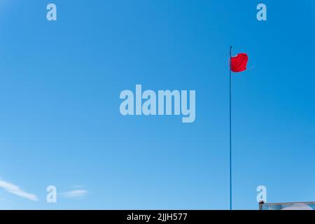 Flag red background wave fabric sky streamer riband satin seamless, from animation rippled in textile for veil abstract, silken canvas. Cotton brocade Stock Photo