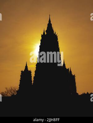 A vertical shot of a silhouette of a Angkor Wat at the sunset in Cambodia Stock Photo