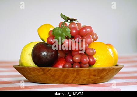 Artificial fruit tray on a table Stock Photo