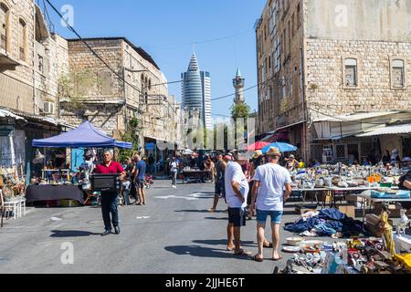 Haifa, Israel - 20 July 2022, Scene of the flea market, with sellers and shoppers, in downtown Haifa, Israel Stock Photo