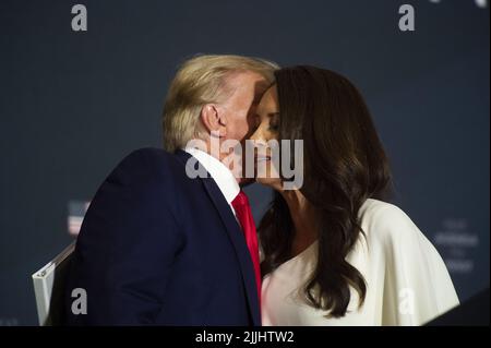 President Donald Trump, left, reacts as Washington Nationals catcher Kurt  Suzuki walks to a podium to speak during an event to honor the 2019 World  Series champion Nationals at the White House