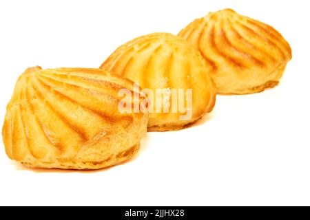Three delicious appetizing profiterole eclair cakes on a white background Stock Photo