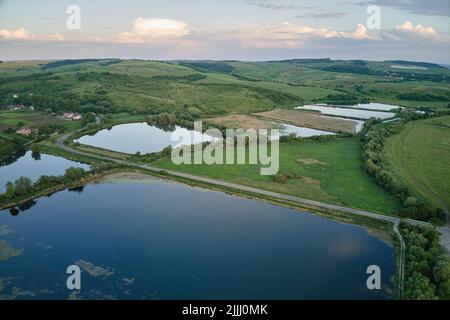 Aerial view of fish hetching pond with blue water in aquacultural area Stock Photo