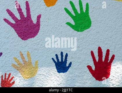 Multicolored handprints on white background. Top view Stock Photo