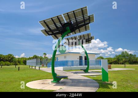 Solar photovoltaic panels mounted on city street pole for electricity supply of streetlights and surveillance cameras Stock Photo