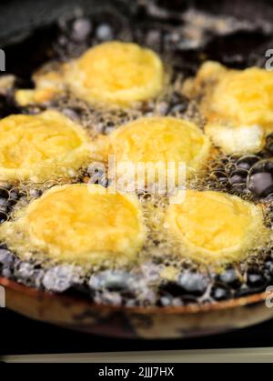 Close Up Frying Potato Nugget (Perkedel Kentang), Home Cooking Process in the Kitchen Stock Photo