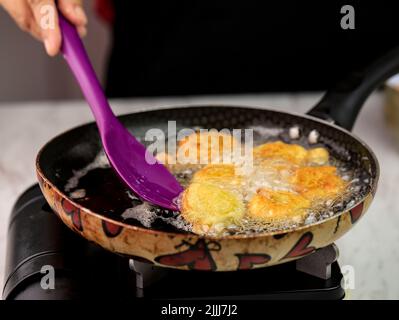 Selected Focus Frying Potato Nugget (Perkedel Kentang), Home Cooking Process in the Kitchen Stock Photo