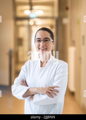 22 July 2022, Hessen, Frankfurt/Main: Maria Vehreschild, head of infectious diseases at Frankfurt University Hospital, is standing in the hallway of one of the buildings. Together with a colleague, she is also head of the Long Covid Outpatient Clinic. (to dpa: 'Long waiting lists for patients with Covid late effects in Hesse') Photo: Frank Rumpenhorst/dpa Stock Photo
