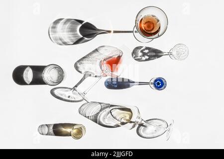 Abstract composition with glassware shadows background. Beautiful reflections from glass on a white backdrop. Natural light. Top view. Stock Photo