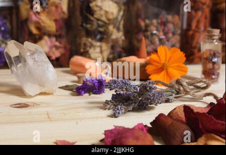 Dried Lavender and Rose Petals on Table With Incense Cones and Rock Crystals Stock Photo