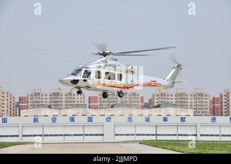 (220727) -- HARBIN, July 27, 2022 (Xinhua) -- Photo taken on July 26, 2022 shows a Z15 (AC352) helicopter in Harbin, northeast China's Heilongjiang Province. The Civil Aviation Administration of China (CAAC) on Tuesday granted certification to the Z15 helicopter, the country's first homegrown, medium-sized helicopter model, for civil use. Z15, also known as AC352, was developed by AVIC Harbin Aircraft Industry Group Co., Ltd. under a cooperation program between AVIC and Airbus Helicopters. It can carry up to 16 passengers with a 7.5-tonne maximum take-off weight and a maximum range of 850 Stock Photo