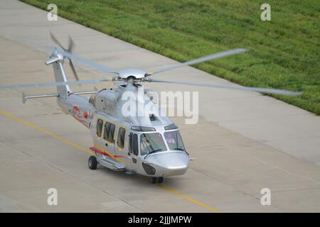 (220727) -- HARBIN, July 27, 2022 (Xinhua) -- Photo taken on July 26, 2022 shows a Z15 (AC352) helicopter in Harbin, northeast China's Heilongjiang Province. The Civil Aviation Administration of China (CAAC) on Tuesday granted certification to the Z15 helicopter, the country's first homegrown, medium-sized helicopter model, for civil use. Z15, also known as AC352, was developed by AVIC Harbin Aircraft Industry Group Co., Ltd. under a cooperation program between AVIC and Airbus Helicopters. It can carry up to 16 passengers with a 7.5-tonne maximum take-off weight and a maximum range of 850 Stock Photo