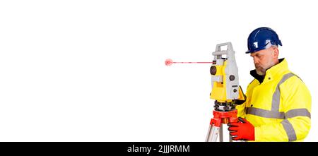 A builder in a blue helmet, yellow reflective hi-visibility coat and red safety gloves on white background with space for text using modern surveying Stock Photo