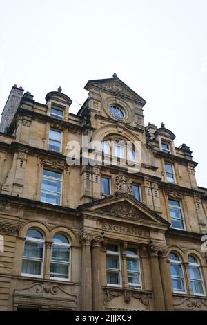 The stone facade of the newly restored Cardiff Coal Exchange office building, now open as a luxury hotel. In Cardiff, Wales, United Kingdom. Stock Photo