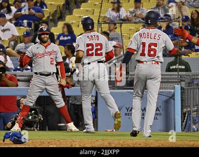 Los Angeles, United States. 27th July, 2022. Washington Nationals Luis  Garcia (2) is greeted by teammate Lane Thomas (L) after hitting a solo home  run to right off Los Angeles Dodgers reliever