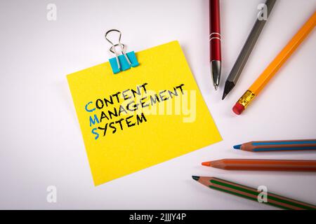 Content Management System. Stationery on a white office table. Stock Photo