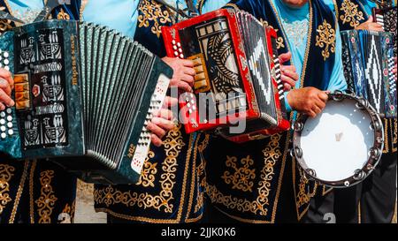 Kazan, Russia. 2022, June 18. Playing the accordion close-up. Old musical instrument Russian bayan. Folk Song and Dance Ensemble  Stock Photo