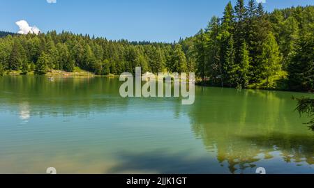 Lake Tret is among the most beautiful forest lakes of South Tyrol, Italy - Europe. Lake Tret is one of the best-loved places in the Val di Non Valley. Stock Photo