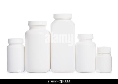 Medical bottles in the row isolated on white Stock Photo - Alamy