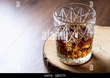 Scotch whiskey glass, on wooden table Stock Photo