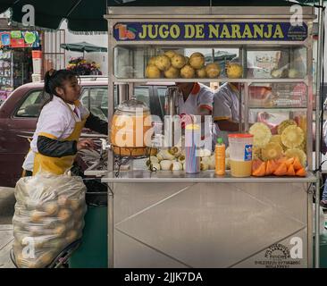 A closeup of an orange juice stand outside the Mercado Central in Lima, Peru Stock Photo