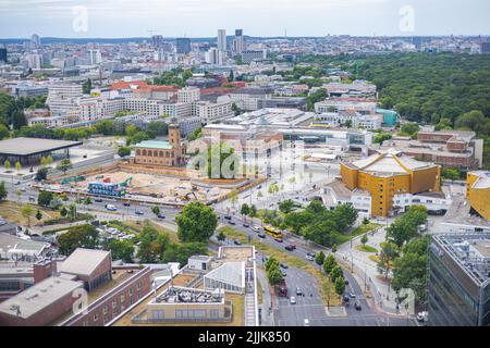 Berlin, Germany - June 29, 2022: Aerial Cityscape of the german capital. Captured from the Kollhoff Tower at the Potsdamer Platz. City stretches far b
