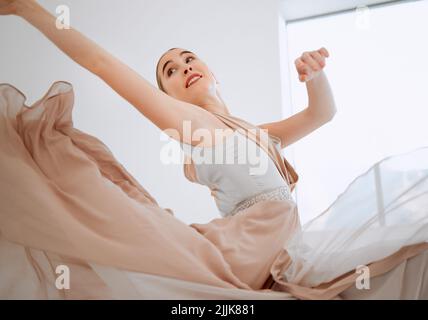 Dance with a sparkle in your eyes. an attractive young female ballerina practicing in her dance studio. Stock Photo