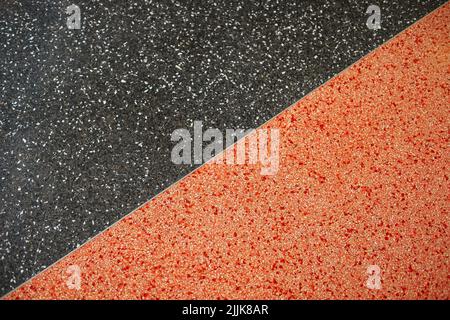 closeup shot of black and orange colored concrete Stock Photo