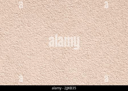 Beige concrete texture, light brown paint background, cement wall surface. Template with copy space. Stucco, plaster. Pastel backdrop design. Natural Stock Photo