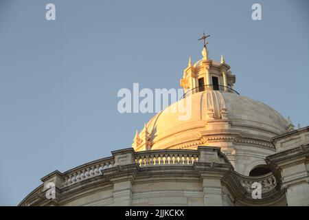 The Dome roof and stone architectural detail on a building against a blue sky Stock Photo