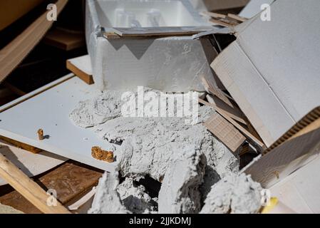 Diverse waste in a container for waste during or after a renovation. There are no trademarks or people in the shot. Stock Photo
