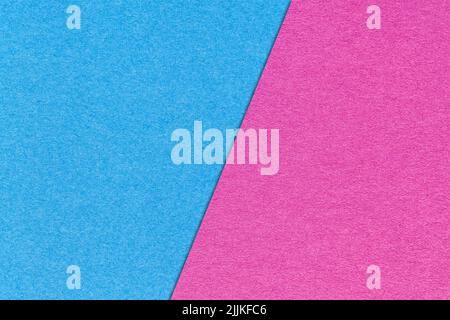 Texture of craft light blue and lilac paper background, half two colors, macro. Structure of vintage dense magenta cardboard. Felt neon backdrop close Stock Photo