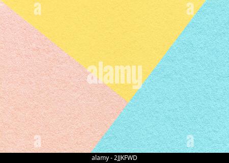 Texture of craft pink, blue and light yellow shade color paper background, macro. Structure of vintage abstract pastel cardboard with geometric shape Stock Photo