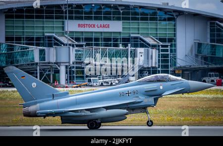 Laage, Germany. 27th July, 2022. A Eurofighter takes off from the air base for a flight toward Estonia. A total of four fighter aircraft are to be deployed as part of NATO's long-standing mission to provide air security for the Baltic states on the military alliance's eastern flank. The aircraft from Tactical Air Squadron 71 'Richthofen' are to fly missions from Ämari (Estonia) in the coming weeks. Credit: Jens Büttner/dpa/Alamy Live News Stock Photo