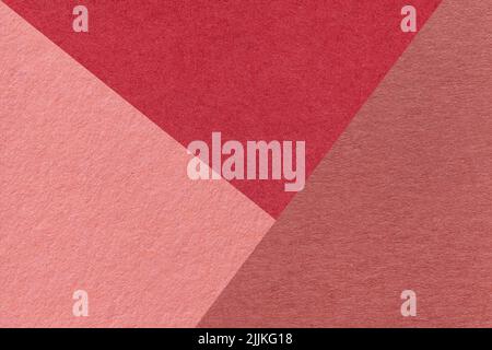 Texture of craft red, pink and wine shade color paper background, macro. Structure of vintage abstract rose cardboard with geometric shape and gradien Stock Photo