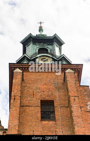 Vertical shot of The Royal Gniezno Cathedral shot in cloudy day Stock Photo