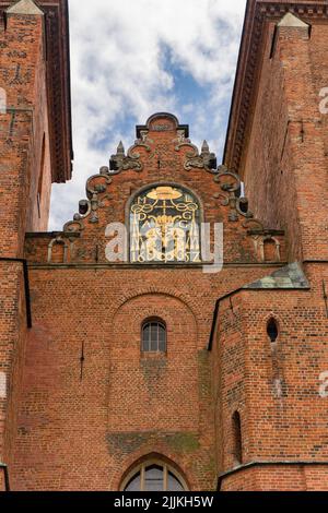 Vertical shot of The Royal Gniezno Cathedral shot in cloudy day Stock Photo