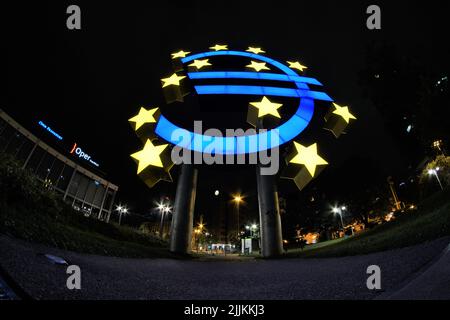 A low angle shot of an illuminated big Euro sign at night in Frankfurt, Germany Stock Photo