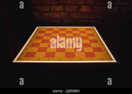 Close up on a modern chess board with light Stock Photo