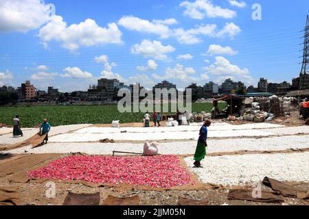 Works Work in a plastic bottle recycling factory in Dhaka, Bangladesh. Stock Photo