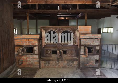 Ovens of the old crematorium in the former Dachau Concentration Camp (Konzentrationslager Dachau), now the Dachau Concentration Camp Memorial Site (KZ-Gedenkstätte Dachau) in Dachau near Munich in Bavaria, Germany. The crematorium was built in the summer of 1940, after the foreign prisoners arrived and the mortality rate greatly increased. The crematorium was in operation until about April 1943. During this period approximately 11,000 prisoners were cremated here. Stock Photo