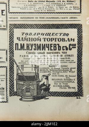 Printed advertisement of the Tea Shop of Pavel Kousmichoff now known as the Kusmi Tea Shop in Paris, France, published in the Russian émigré newspaper 'Poslednie Novosti' ('The Last News') on 15 May 1924. The brand previously known as the Tea Trade Partnership of Pavel Kousmichoff and His Sons established in 1867 in Saint Petersburg, Russia, and known now as the Kusmi Tea had its main tea shop in Avenue Victor Hugo 11 Bis in Paris, France, and also branches and storages in London, Berlin, Hamburg, New York, Belgrade, Constantinople and Buenos Aires. Stock Photo