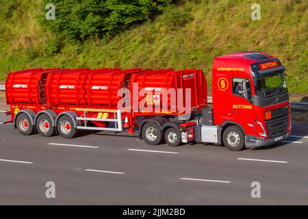 SUTTONS GROUP 2022 red Volvo 12777 cc  HGV transporting BOC Gases on the M6 motorway, UK Stock Photo