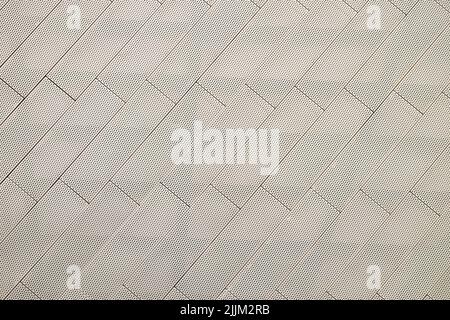 The background image that makes the eyes ripple. Lines and dots on a light gray metallic background Stock Photo