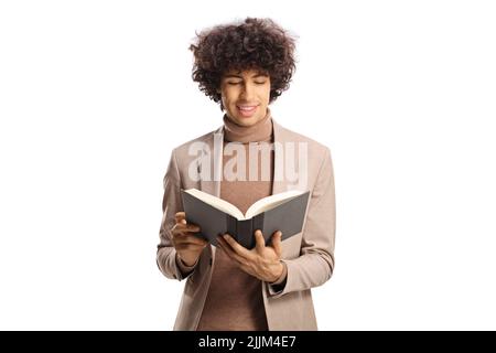Young man with dark curly hair reading a book isolated on white background Stock Photo