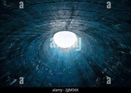 The abstract blue background with a bright light in the center. Stock Photo