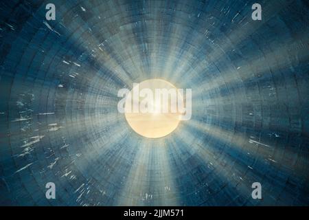 The abstract blue background with a bright light in the center. Stock Photo
