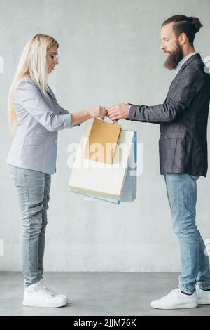 shopping store delivery man giving bags woman Stock Photo